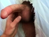 Filling the cocksucker's mouth at the homemade glory hole